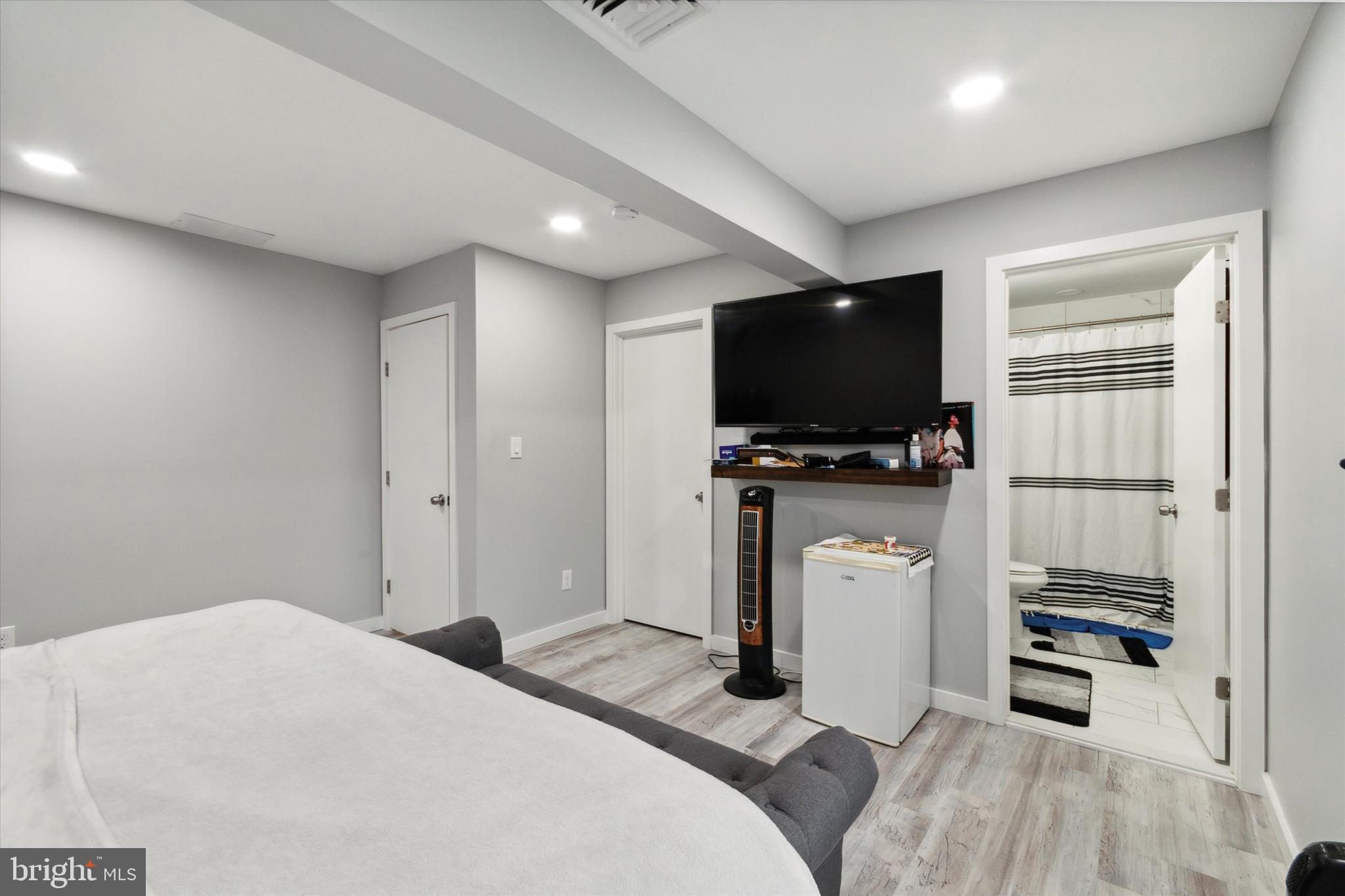 113 Kresson Gibbsboro Road, Unit 2 Voorhees, NJ 08043 - Photo 22 of 25 a bedroom with a bed and a flat screen tv