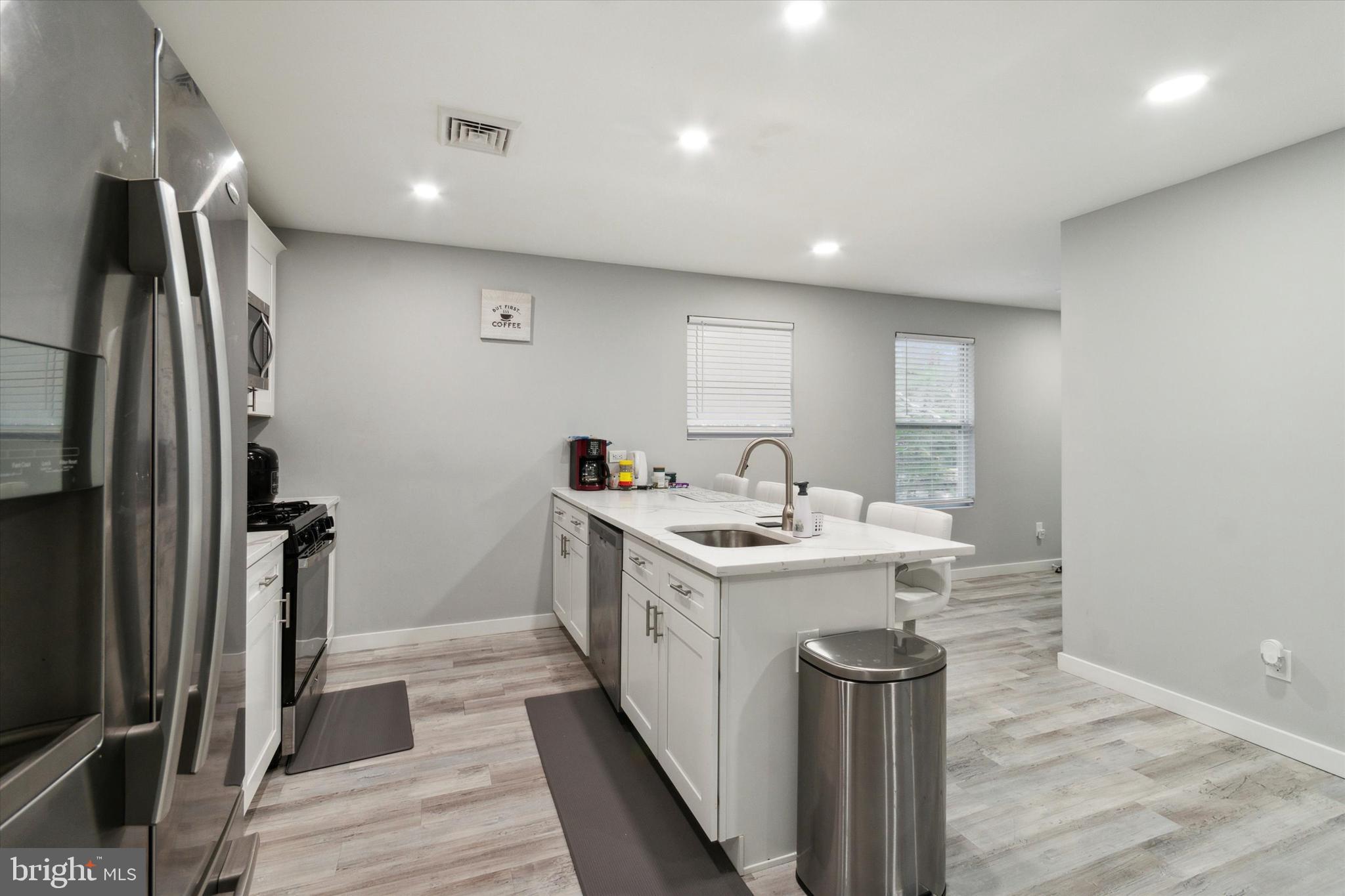 113 Kresson Gibbsboro Road, Unit 2 Voorhees, NJ 08043 - Photo 5 of 25 a kitchen with a sink stainless steel appliances and cabinets