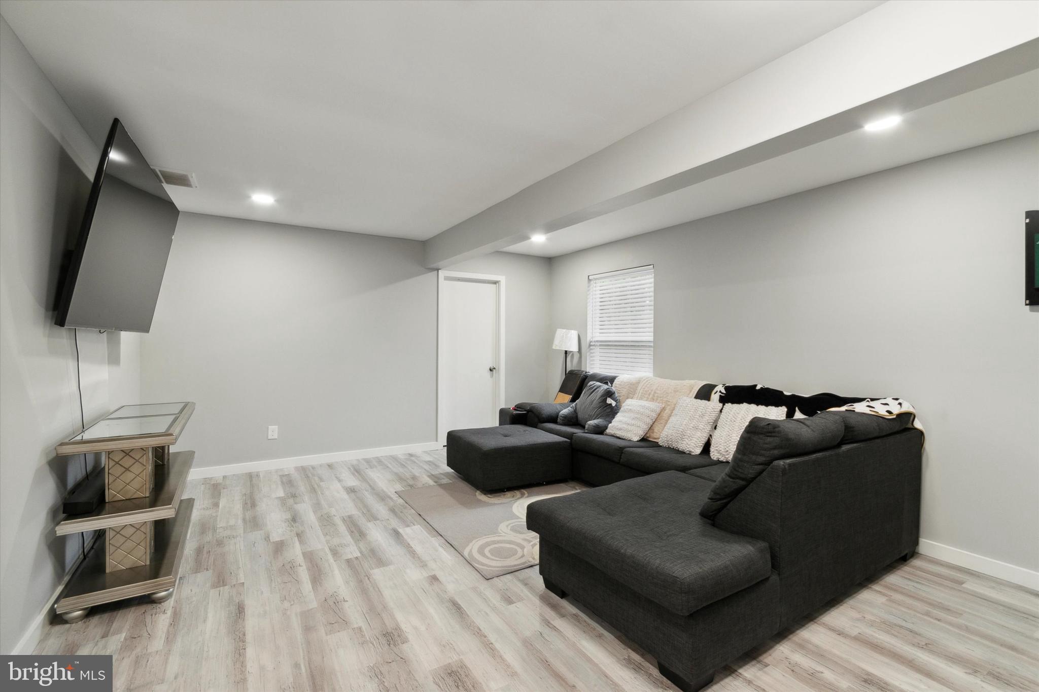 113 Kresson Gibbsboro Road, Unit 2 Voorhees, NJ 08043 - Photo 7 of 25 a living room with furniture and a flat screen tv