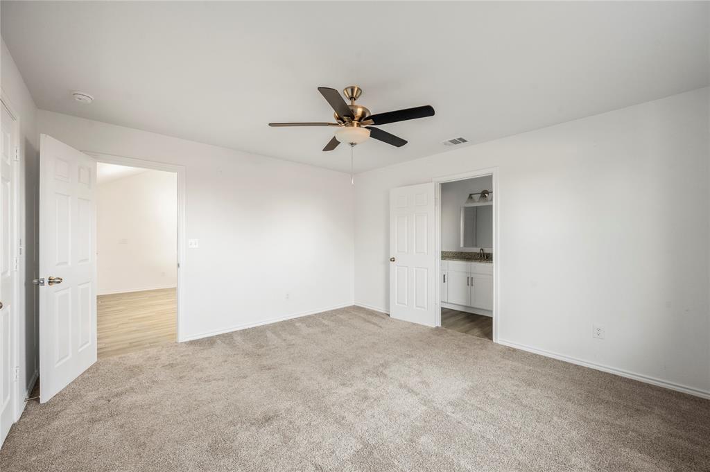 437 Whitney Court Rio Vista, TX 76093 - Photo 16 of 21 an empty room with closet and a ceiling fan