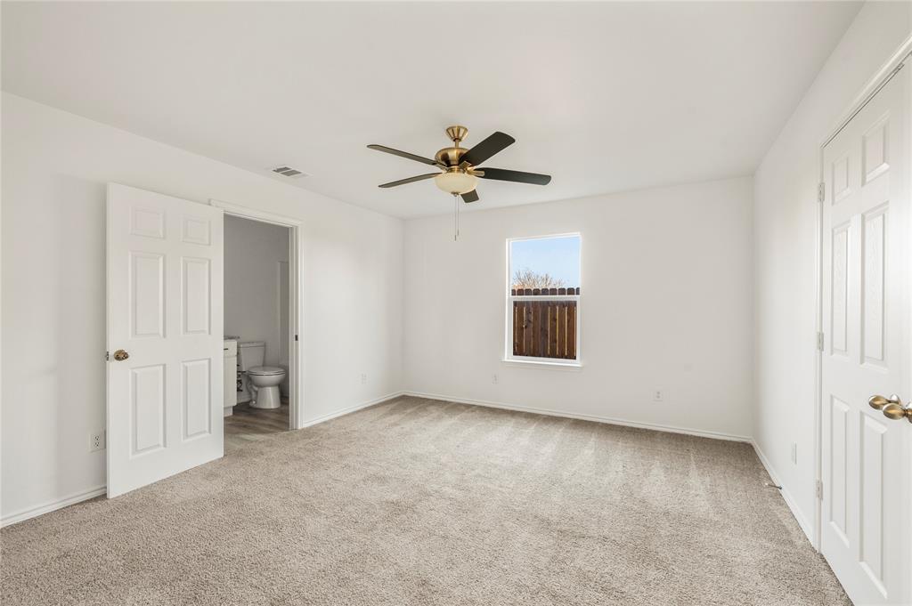 437 Whitney Court Rio Vista, TX 76093 - Photo 17 of 21 an empty room with fan and windows