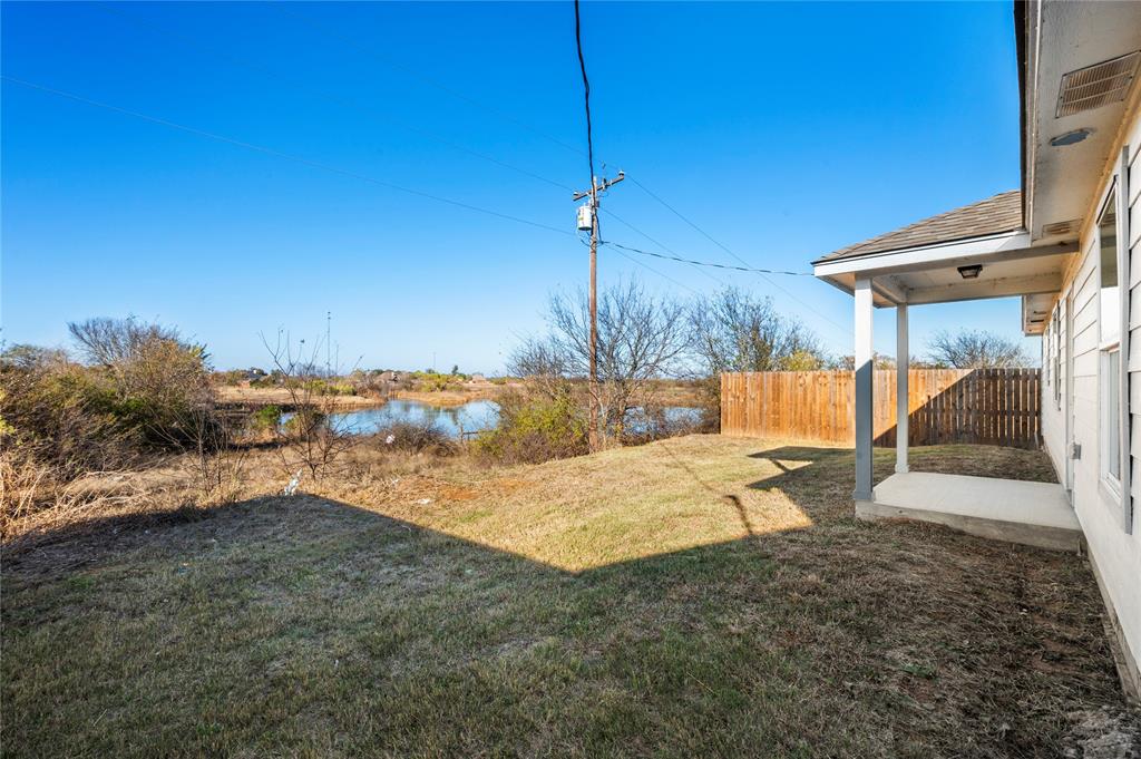 437 Whitney Court Rio Vista, TX 76093 - Photo 20 of 21 a view of a backyard with a patio