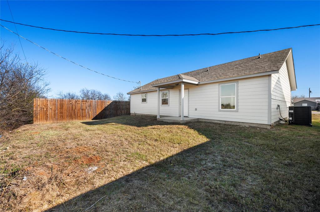437 Whitney Court Rio Vista, TX 76093 - Photo 21 of 21 a view of a house with a backyard