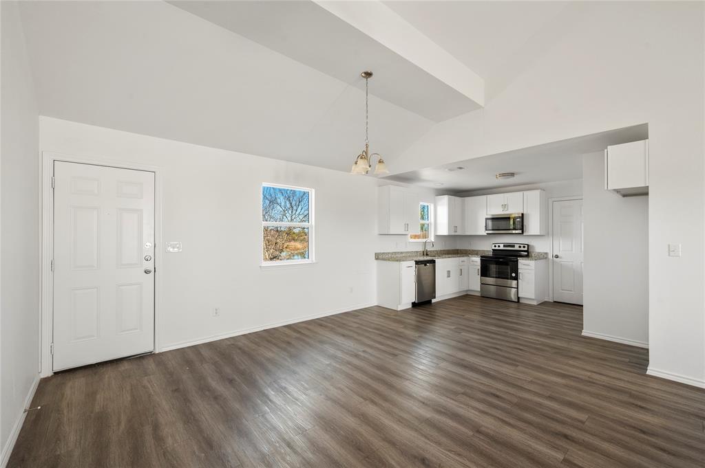 437 Whitney Court Rio Vista, TX 76093 - Photo 5 of 21 a view of a kitchen with a sink cabinets and window