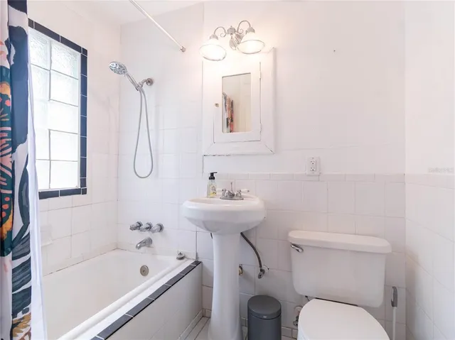 a bathroom with a bathtub and a sink