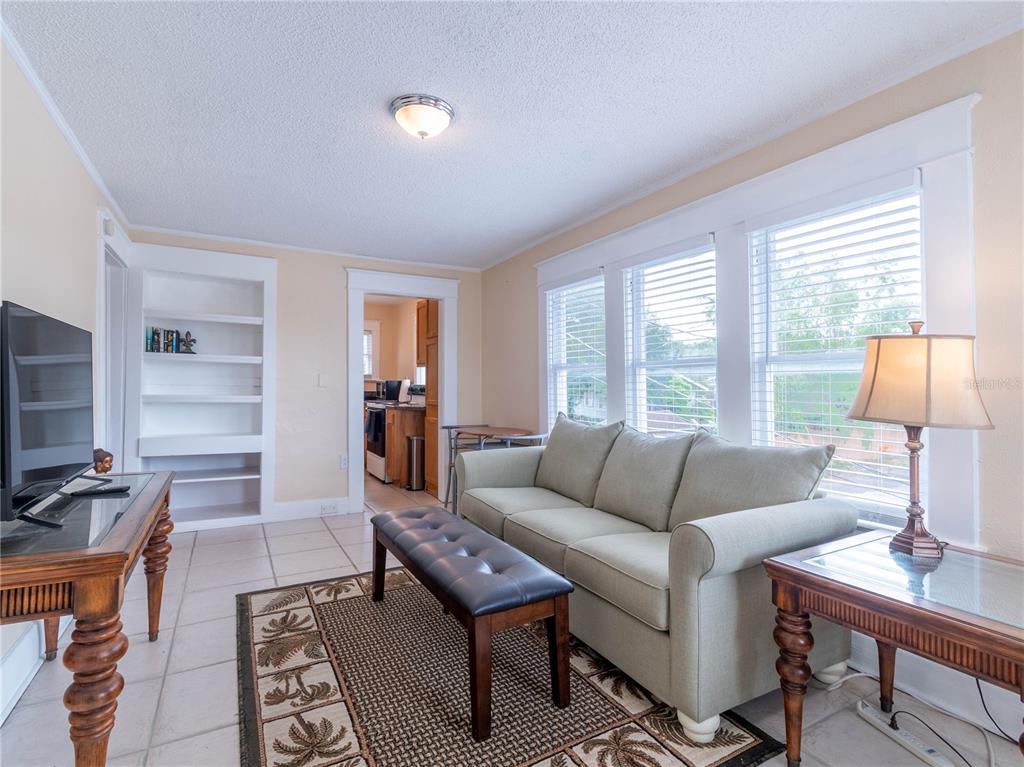 103 East Mohawk Avenue, Unit A Tampa, FL 33604 - Photo 8 of 19 a living room with furniture and a flat screen tv