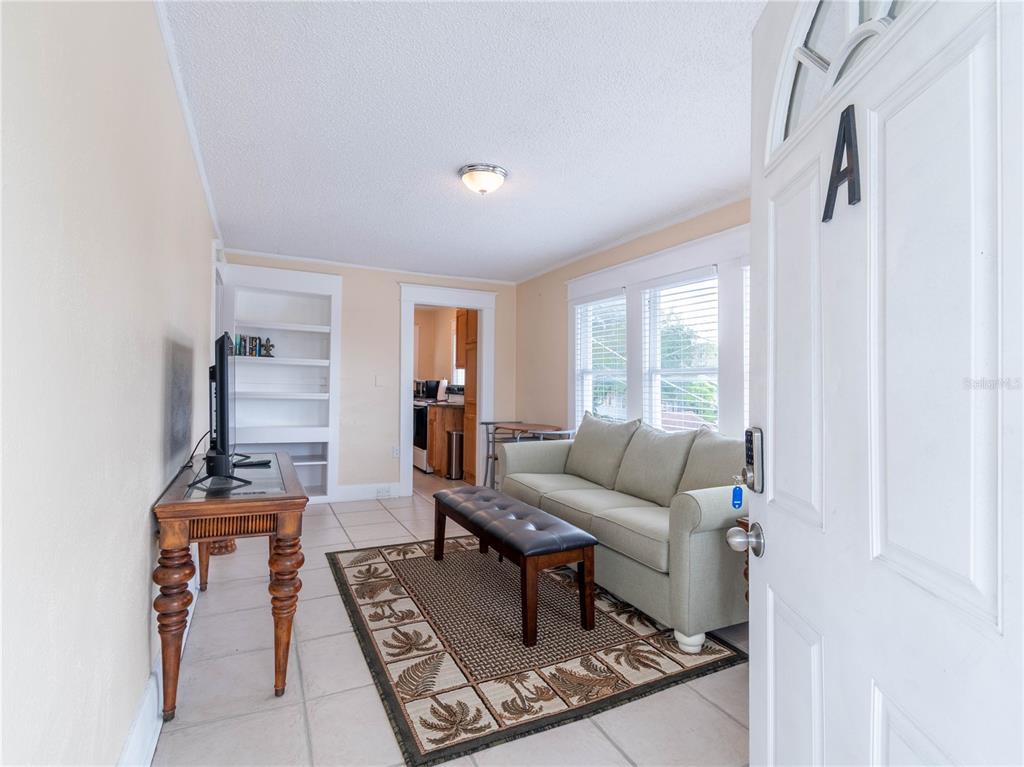 103 East Mohawk Avenue, Unit A Tampa, FL 33604 - Photo 9 of 19 a living room with furniture and a window