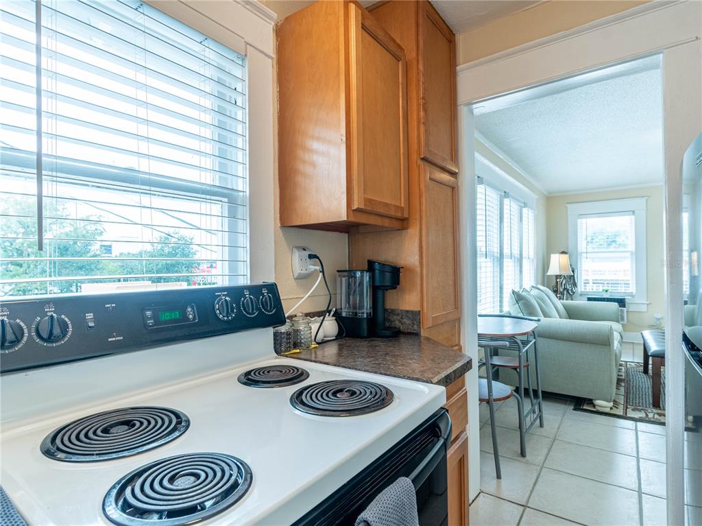 103 East Mohawk Avenue, Unit A Tampa, FL 33604 - Photo 10 of 19 a kitchen with a table and chairs in it