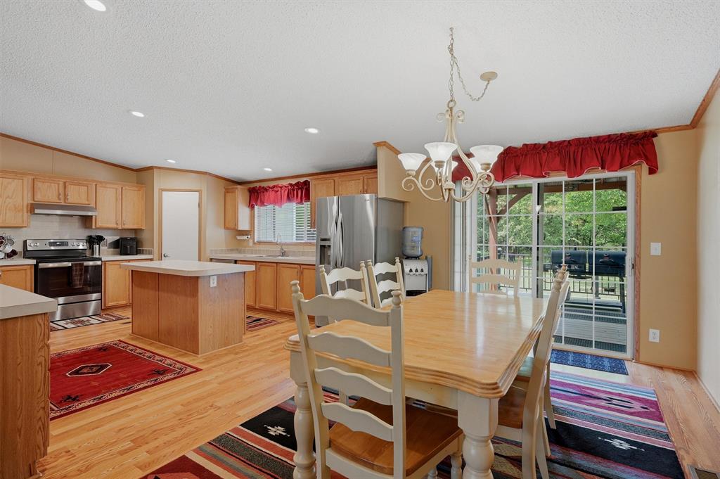 212 Sunset Road Pottsboro, TX 75076 - Photo 8 of 40 a dinning table and chairs in the kitchen