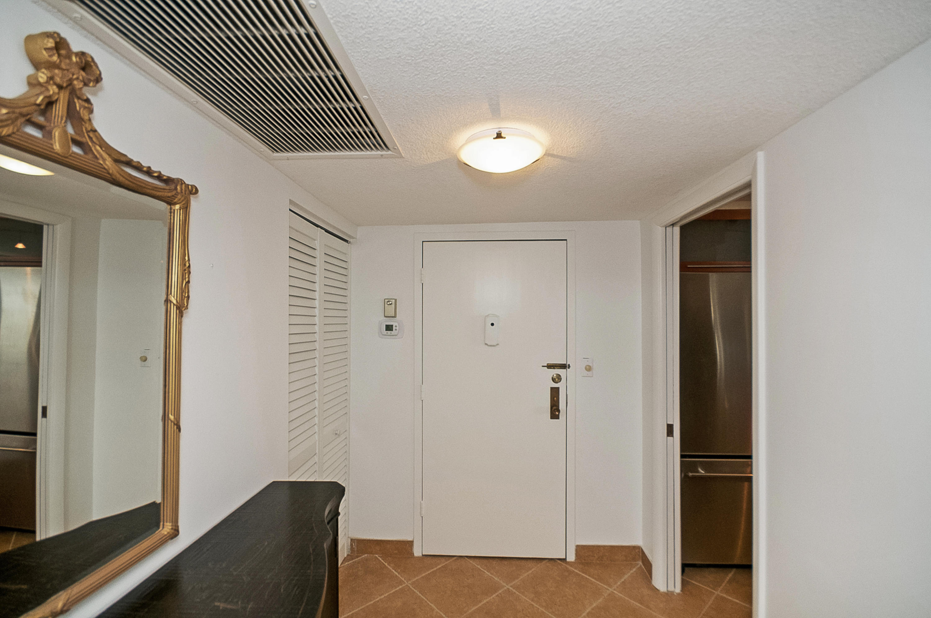 2121 North Ocean Boulevard, Unit 1602E Boca Raton, FL 33431 - Photo 12 of 64 FOYER-COAT CLOSET