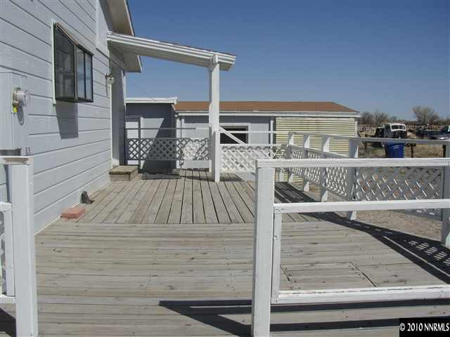 4100 Schindler Road Fallon, NV 89406 - Photo 7 of 7 a view of balcony with wooden floor and seating space