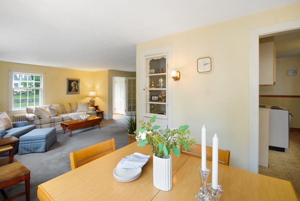 3 Sherburne Road Lexington, MA 02421 - Photo 16 of 42 a living room with furniture couches and a dining table with wooden floor
