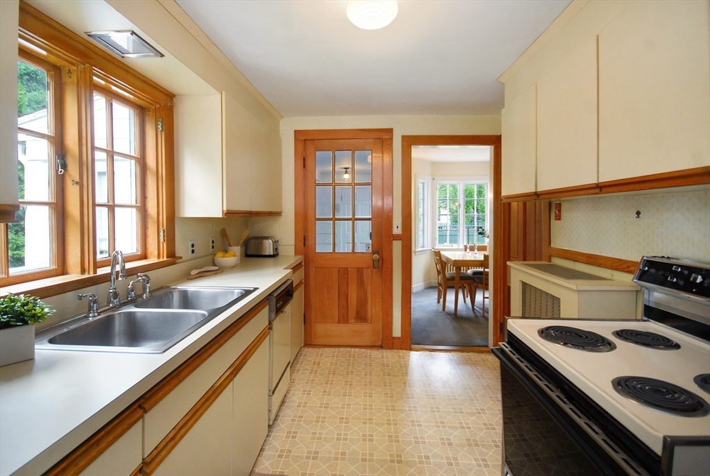3 Sherburne Road Lexington, MA 02421 - Photo 17 of 42 a kitchen with a sink a stove and cabinets