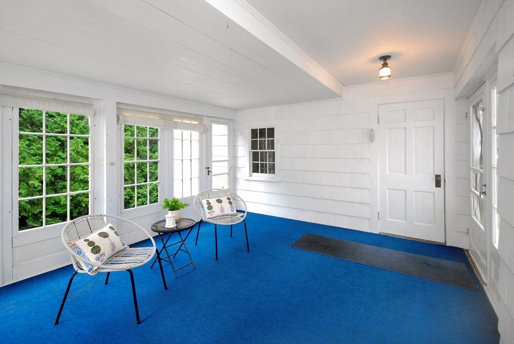 3 Sherburne Road Lexington, MA 02421 - Photo 20 of 42 a living room with furniture and a large window