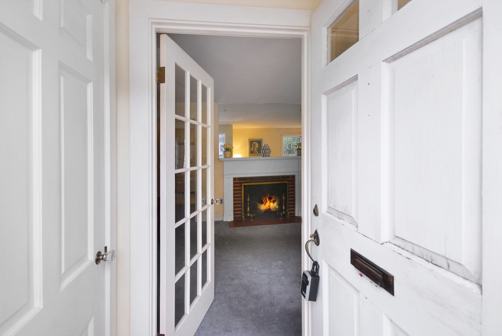 3 Sherburne Road Lexington, MA 02421 - Photo 2 of 42 a view of an entryway with a fireplace