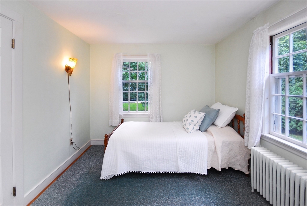 3 Sherburne Road Lexington, MA 02421 - Photo 26 of 42 a bedroom with a bed and a window