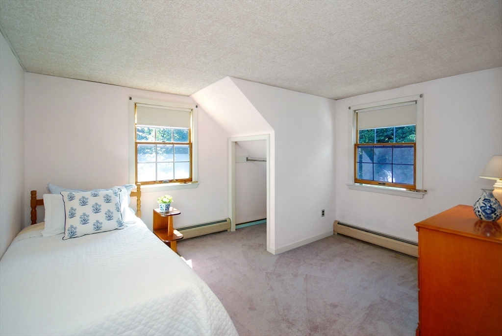 3 Sherburne Road Lexington, MA 02421 - Photo 30 of 42 a bedroom with a bed and a window