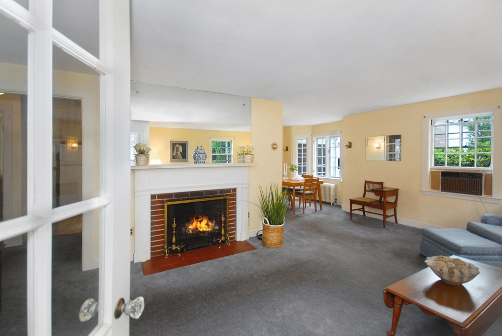 3 Sherburne Road Lexington, MA 02421 - Photo 3 of 42 a living room with furniture and a fireplace