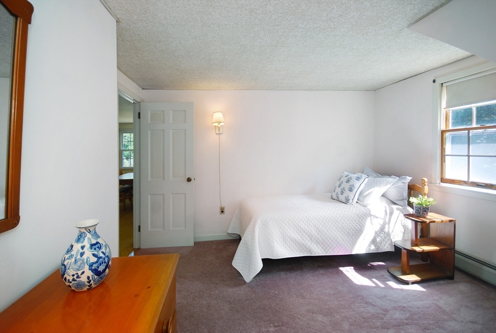 3 Sherburne Road Lexington, MA 02421 - Photo 31 of 42 a bedroom with a bed and a window