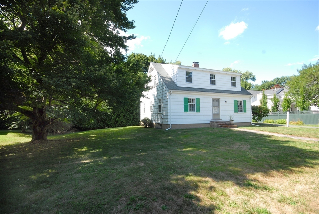 3 Sherburne Road Lexington, MA 02421 - Photo 34 of 42 a front view of a house with a garden