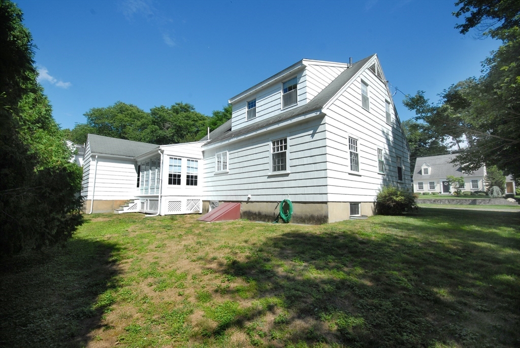 3 Sherburne Road Lexington, MA 02421 - Photo 37 of 42 a front view of a house with a yard