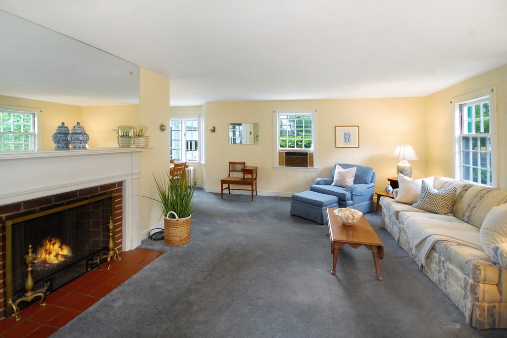 3 Sherburne Road Lexington, MA 02421 - Photo 4 of 42 a living room with furniture and a fireplace