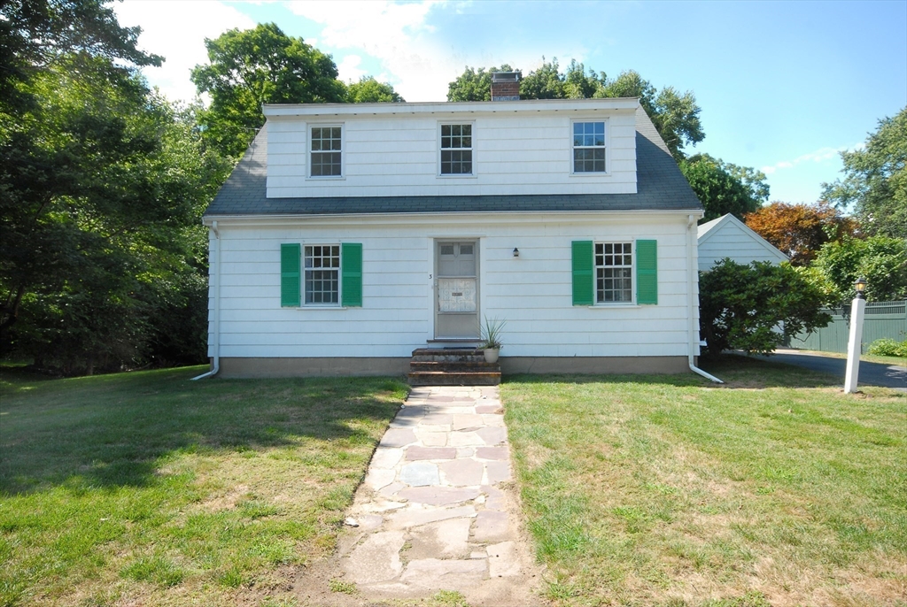 3 Sherburne Road Lexington, MA 02421 - Photo 42 of 42 a front view of a house with a yard and garage