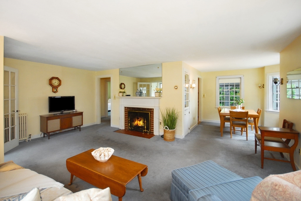 3 Sherburne Road Lexington, MA 02421 - Photo 6 of 42 a living room with furniture and a fireplace