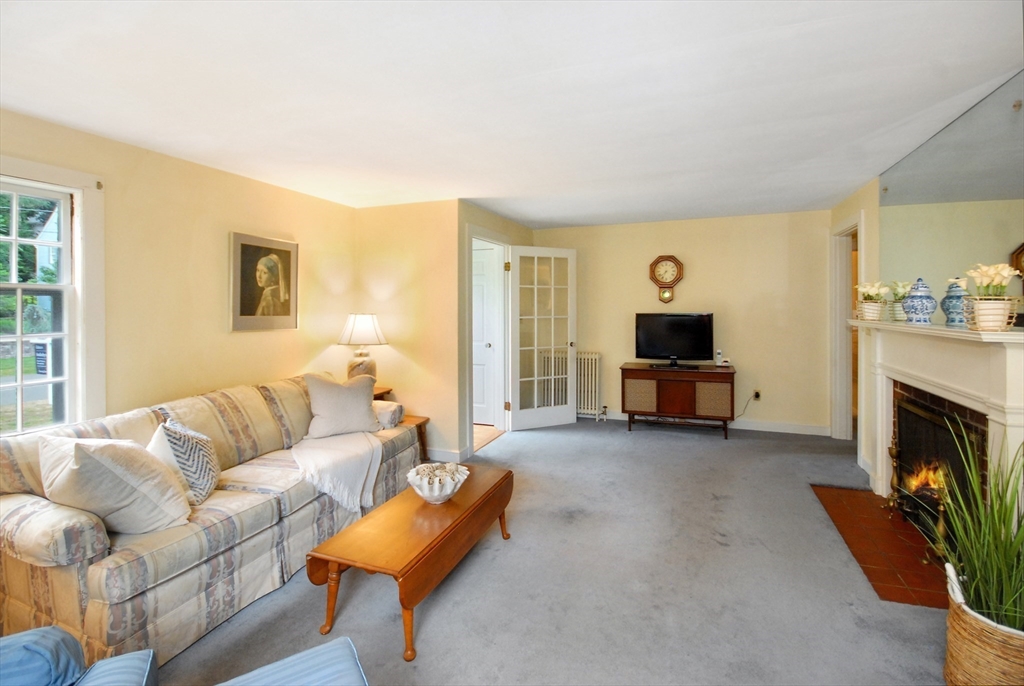 3 Sherburne Road Lexington, MA 02421 - Photo 7 of 42 a living room with furniture and a fireplace