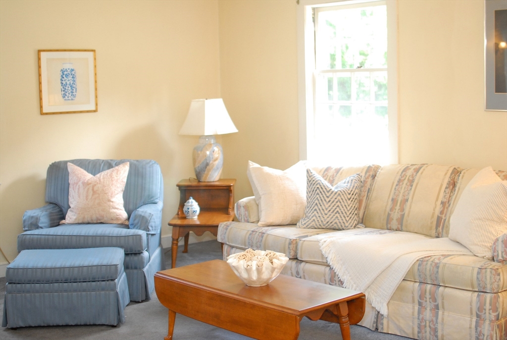 3 Sherburne Road Lexington, MA 02421 - Photo 8 of 42 a living room with furniture and a lamp