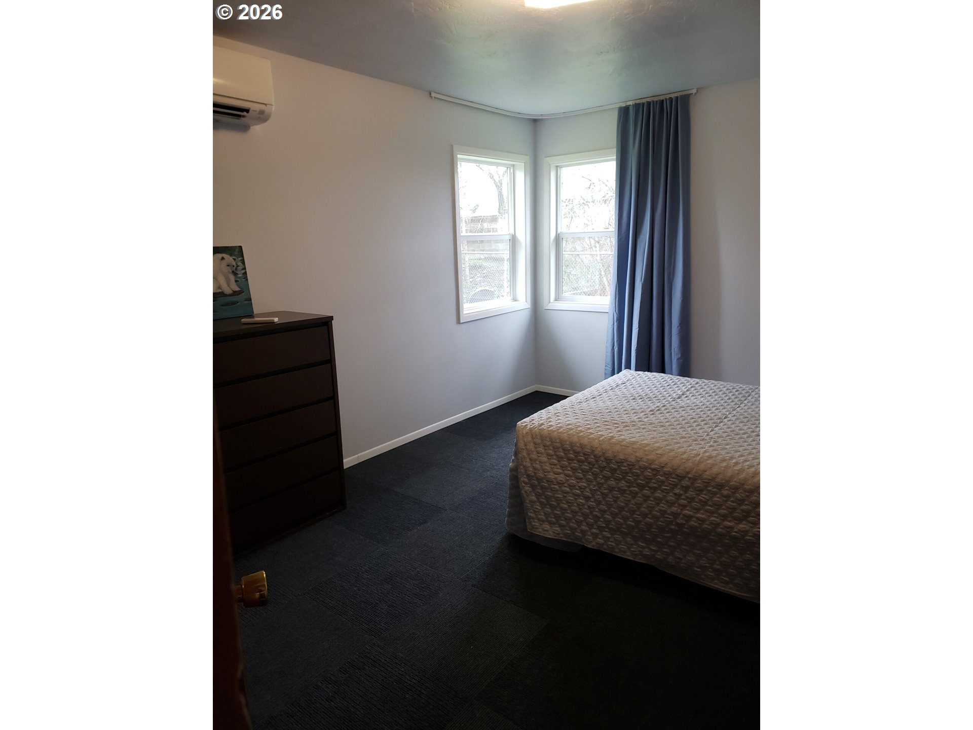 1441 West Main Street Molalla, OR 97038 - Photo 11 of 24 a bedroom with a bed and a window