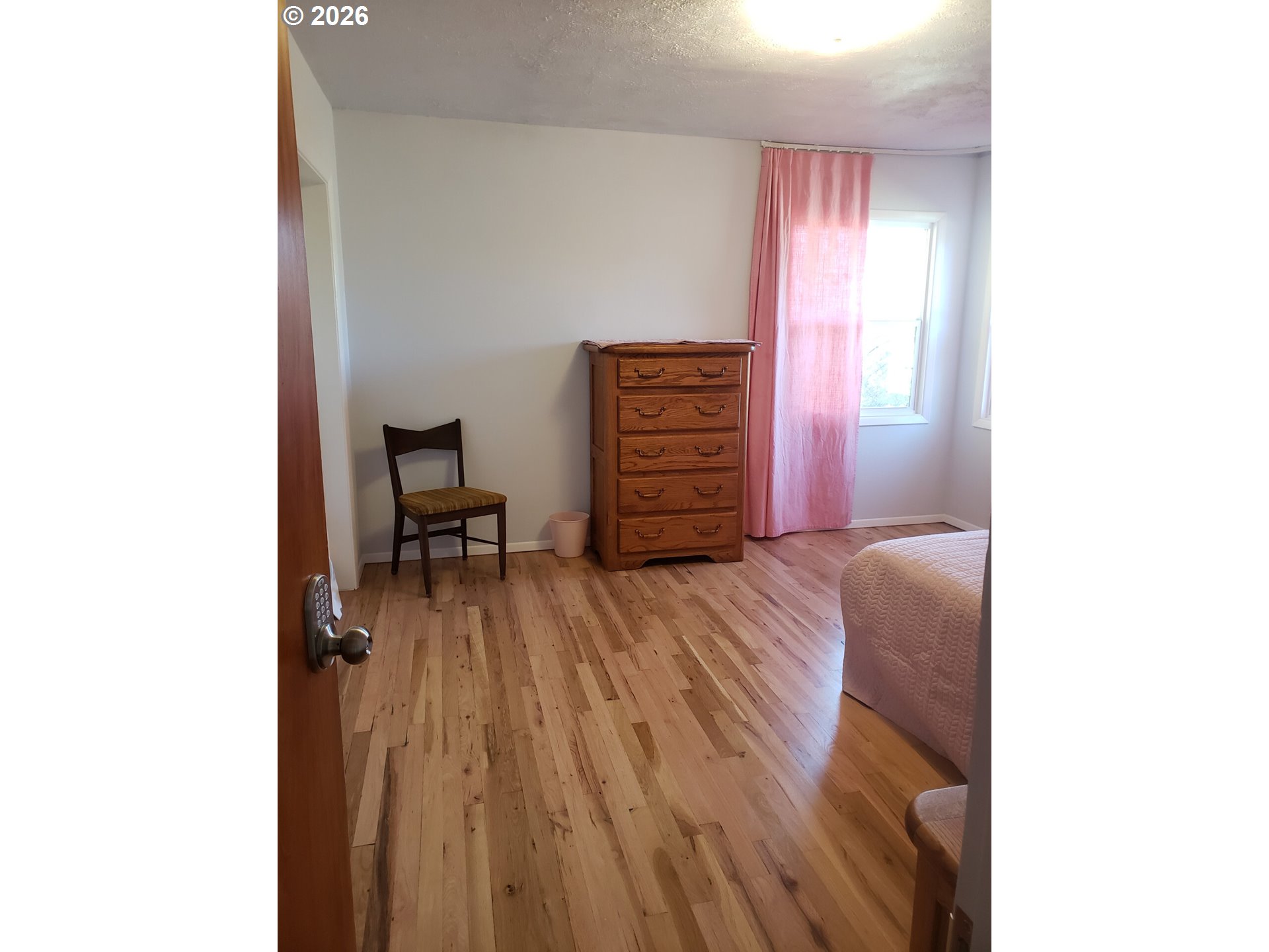 1441 West Main Street Molalla, OR 97038 - Photo 13 of 24 a bedroom with a bed and a dresser