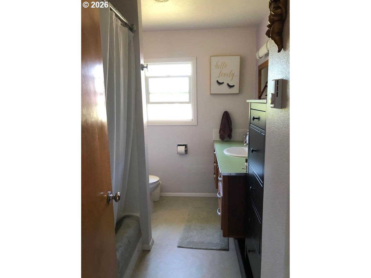 1441 West Main Street Molalla, OR 97038 - Photo 10 of 24 a bathroom with a toilet and a sink