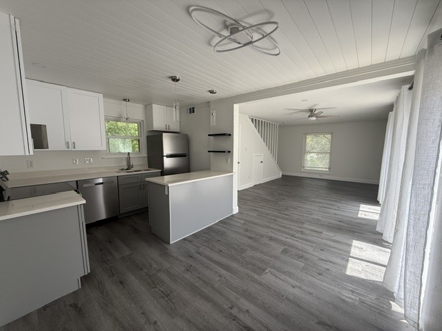 3304 Clawson Road, Unit B Austin, TX 78704 - Photo 3 of 12 An open-concept living space connects the kitchen and living areas, offering cohesive flooring and natural light.