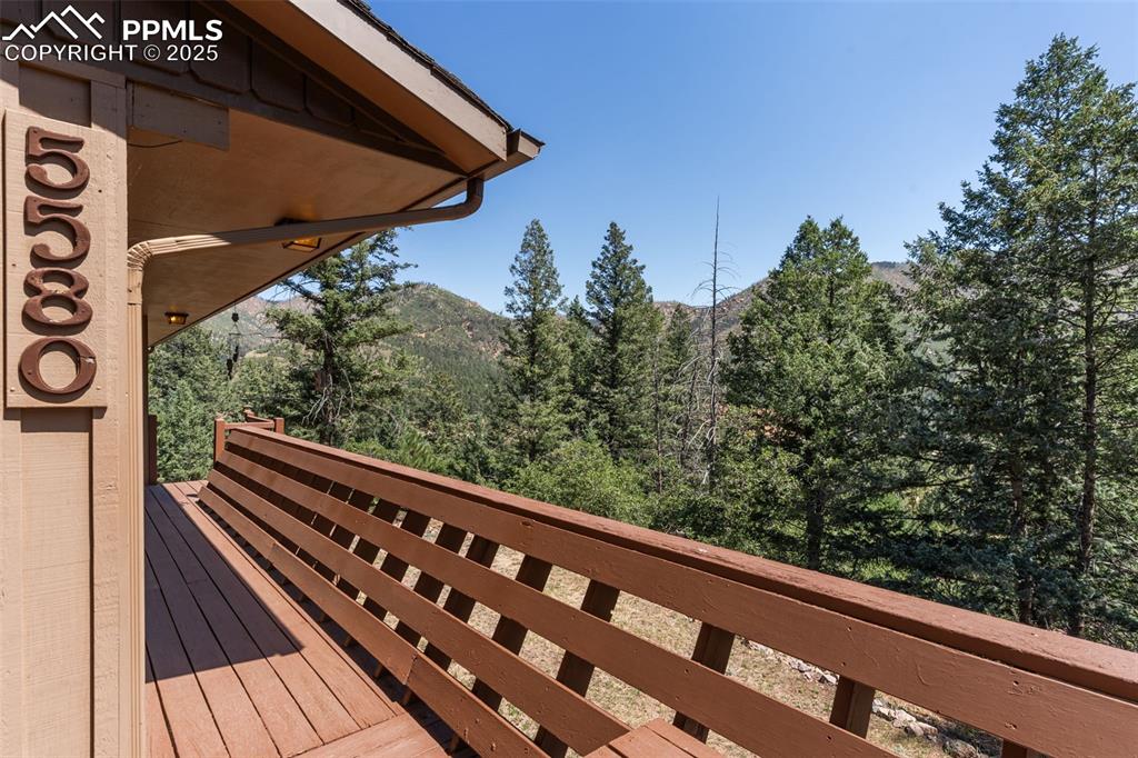 5580 Moosa Road Cascade, CO 80809 - Photo 32 of 35 a view of balcony with wooden floor