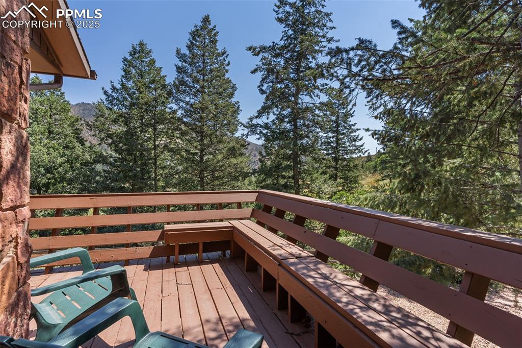 5580 Moosa Road Cascade, CO 80809 - Photo 35 of 35 a view of a balcony with wooden floor and fence