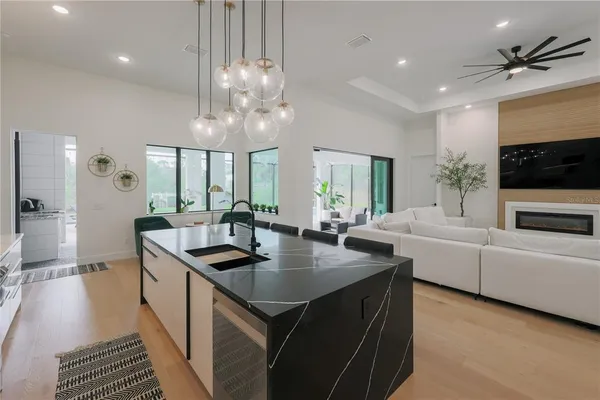 a kitchen with counter top space a sink and appliances