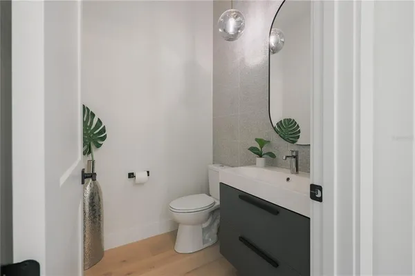 a bathroom with a sink toilet and vanity