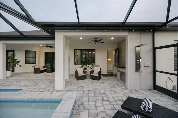 a view of a lobby with chair and glass door