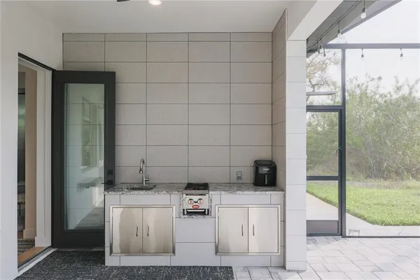 a view of living room kitchen and windows