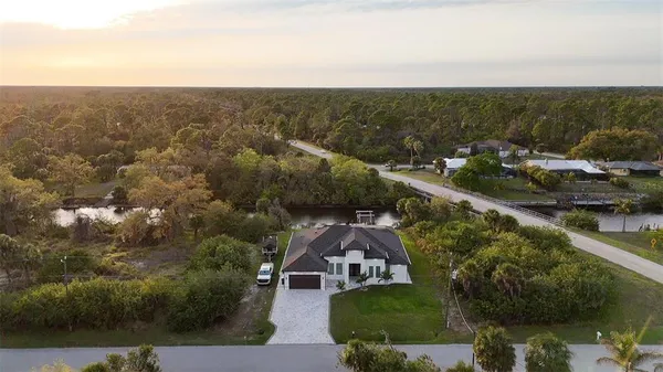 an aerial view of a house with outdoor space