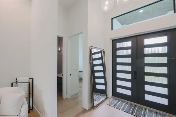 a view of wooden floor and windows in a room