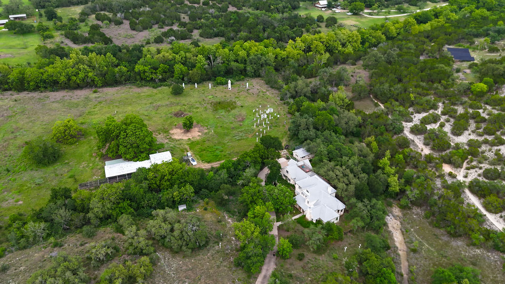 13800 Lone Rider Trail Austin, TX 78738 - Photo 1 of 27 a aerial view of a house with a yard and lake