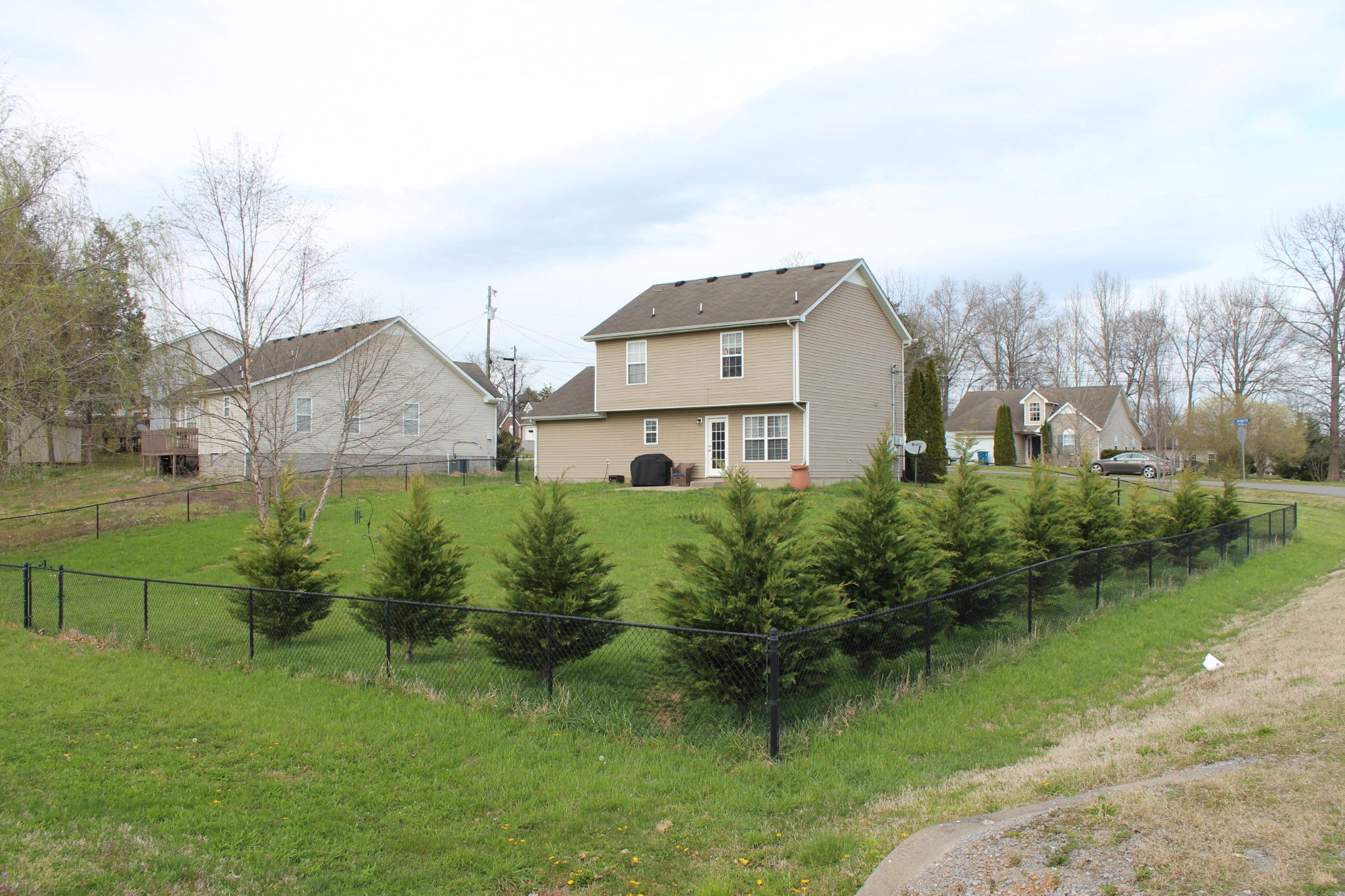 105 Cataract Drive Murfreesboro, TN 37129 - Photo 6 of 8 a view of a big house with a big yard plants and large trees