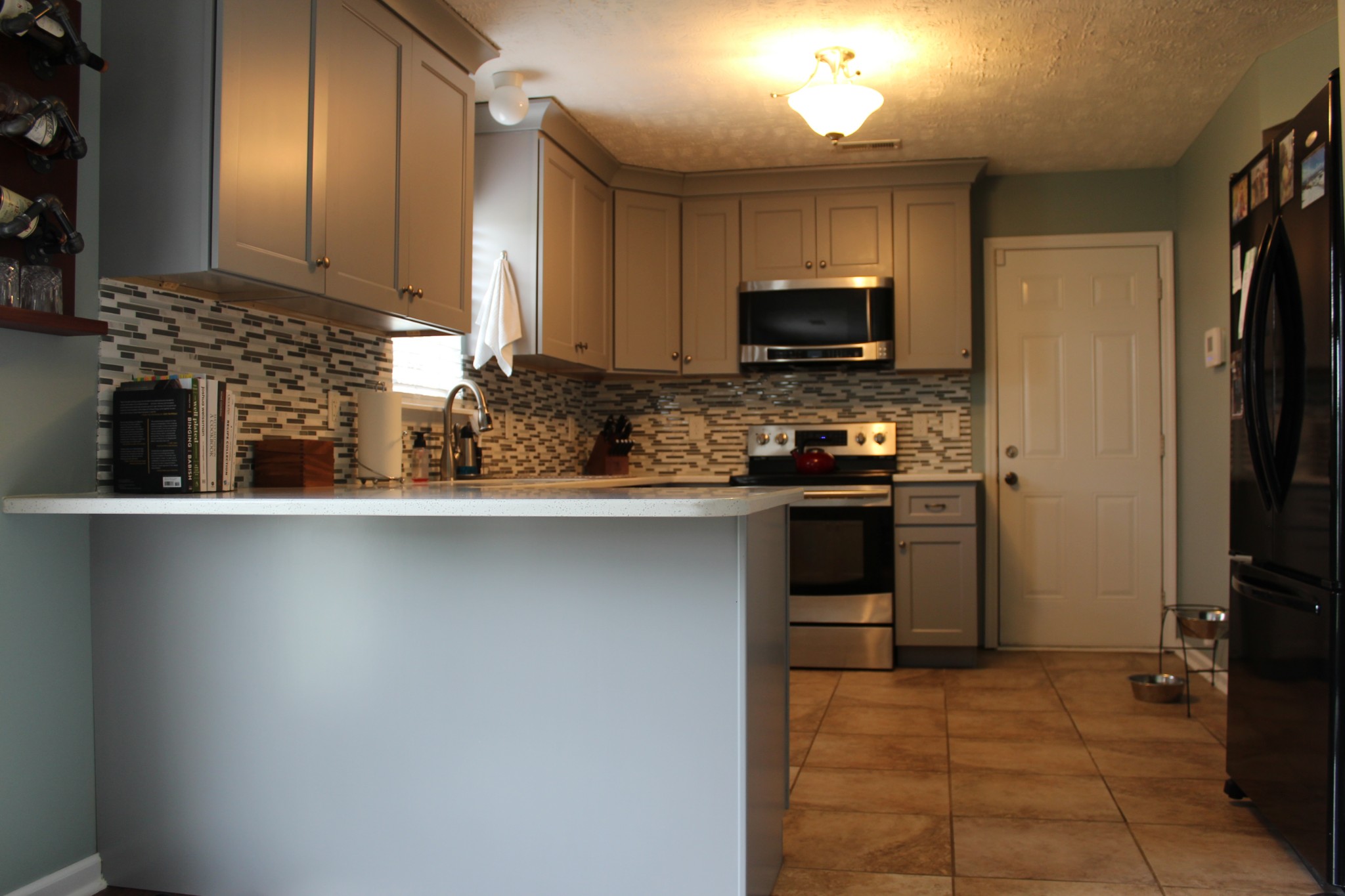 105 Cataract Drive Murfreesboro, TN 37129 - Photo 7 of 8 a kitchen with a sink and a stove top oven