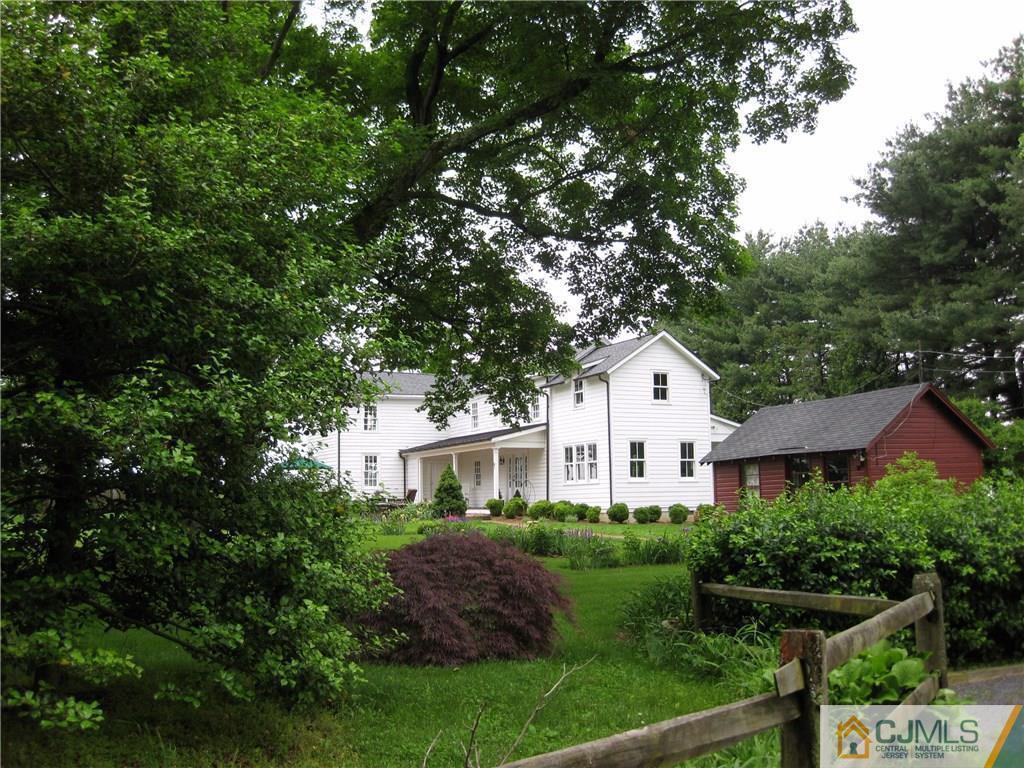 168 Plainsboro Road Cranbury, NJ 08512 - Photo 2 of 25 a front view of a house with a yard and tree s