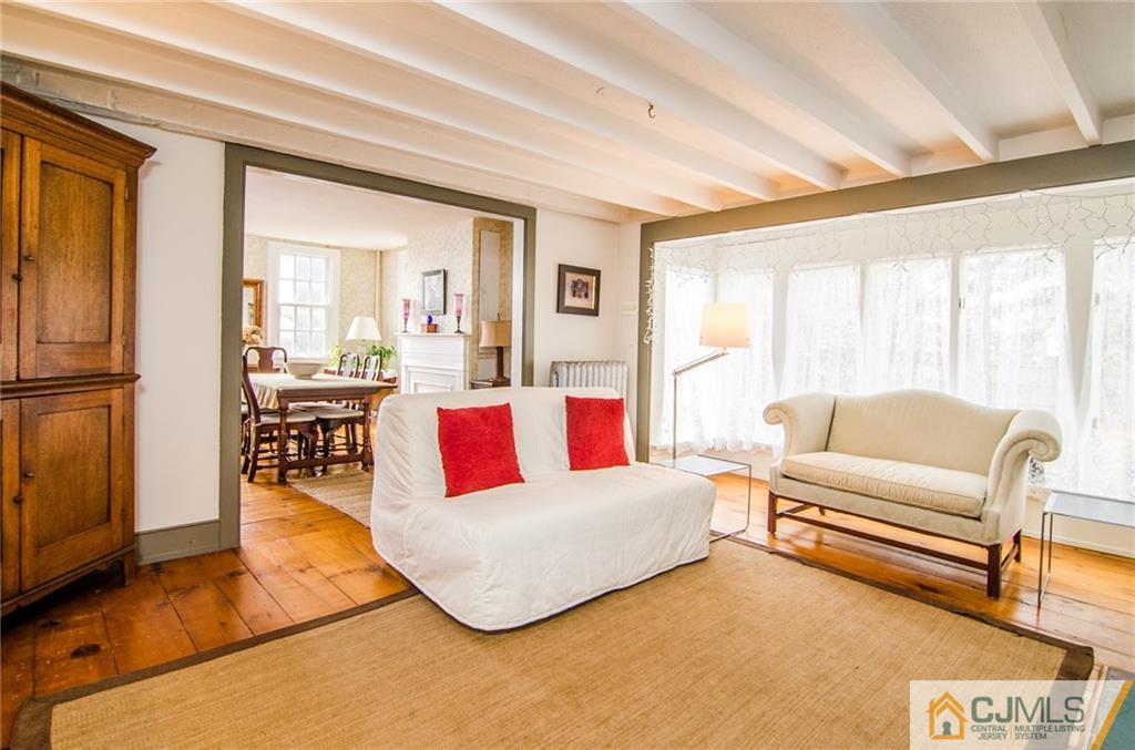 168 Plainsboro Road Cranbury, NJ 08512 - Photo 11 of 25 a living room with furniture and a large window