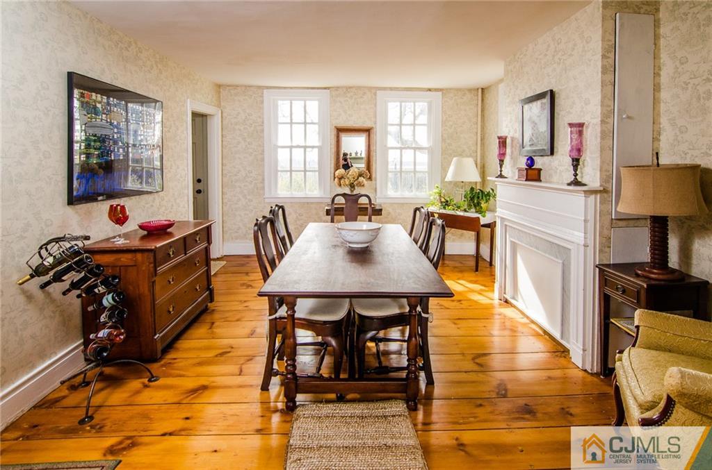 168 Plainsboro Road Cranbury, NJ 08512 - Photo 15 of 25 a view of a dining room with furniture and chandelier