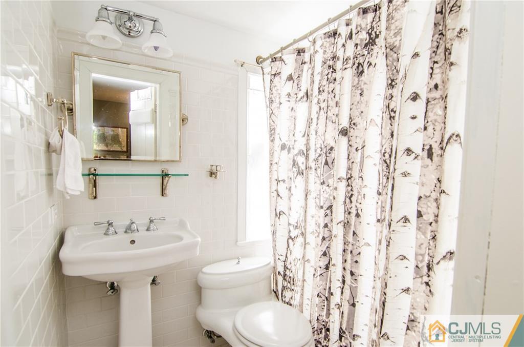 168 Plainsboro Road Cranbury, NJ 08512 - Photo 18 of 25 a bathroom with a sink toilet and shower