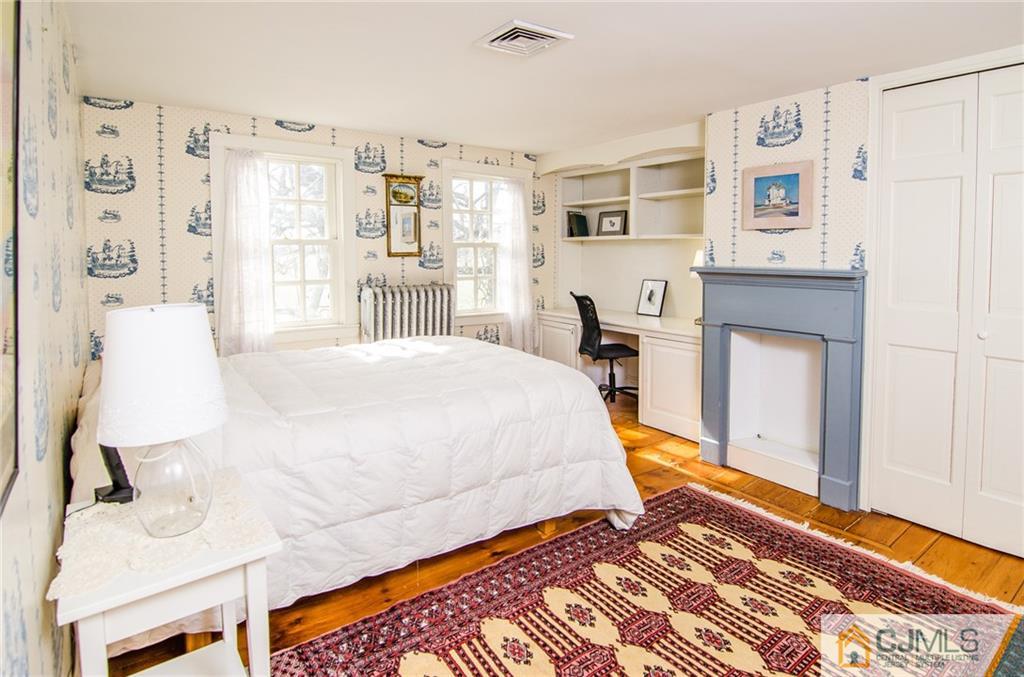 168 Plainsboro Road Cranbury, NJ 08512 - Photo 20 of 25 a bedroom with a bed and a chair